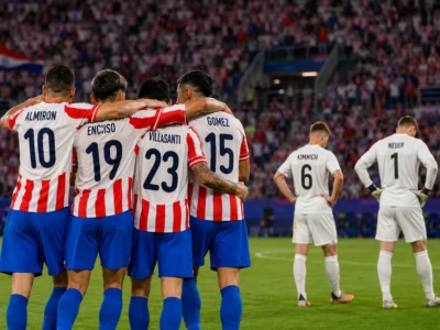 Paraguay players celebrate after beating Germany on penalties in a symbolic World Cup 2026 knockout scene