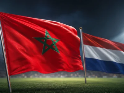 Morocco and Netherlands flags on a stadium pitch after Morocco advanced on penalties at the World Cup