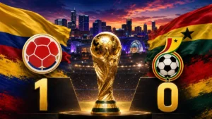 Colombia beat Ghana 1-0 in the 2026 FIFA World Cup as the Colombia and Ghana flags and crests flank the trophy with the score displayed over a Kansas City backdrop.
