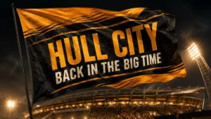 Hull City black and amber flag waving above the MKM Stadium for the 2026/27 season preview titled Back in the Big Time